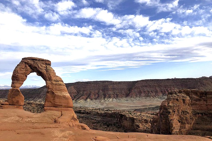 Delicate Arch is seen at Arches National Park. As the world nears its third year of the COVID-19 pandemic, there is at least one industry that is bouncing back — Utah travel and tourism. (AP Photo/Lindsay Whitehurst, File)