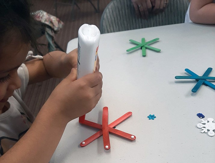 Children participate in a snowflake craft workshop during a Storytime event at the Chino Valley Public Library on Wednesday, Jan. 18, 2022. Starting Feb. 9, Storytime at the library will no longer be at 9:30 a.m. but will move to 3 p.m. to allow young children who attend preschool/kindergarten in the morning (and couldn’t previously attend) to be able to come to an afternoon option. Storytimes are perfect for ages 2 to 6, but older/younger siblings are welcome. The library does about four themed stories, songs/games, a craft and snack each week. Storytimes are held indoors in the library community room. On Feb. 8 only, Storytime will be at 9:30 a.m. but normally, Tuesday Storytime will remain at 10:30 each week. (Town of Chino Valley/Courtesy)