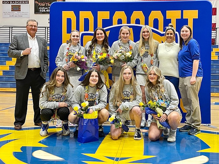 The eight seniors on Prescott girls basketball stand together for a photo during the senior night ceremony that took place prior to team’s game against Cactus on Thursday, Jan. 27, 2022, at Prescott’s dome gym. The Badgers defeated the Cobras 53-27. (Prescott Athletics/Courtesy)