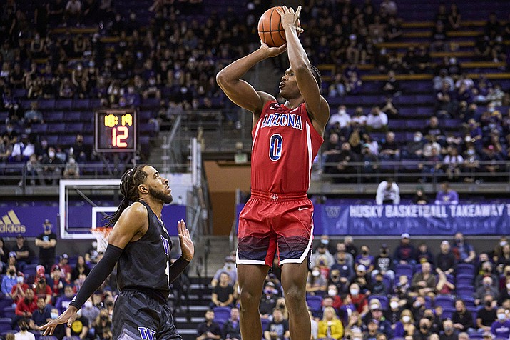Arizona's Bennedict Mathurin shoots over Washington's PJ Fuller during the first half of an NCAA college basketball game Saturday, Feb. 12, 2022, in Seattle. (John Froschauer/AP)