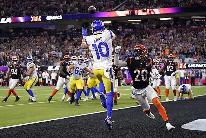 Los Angeles Rams wide receiver Cooper Kupp (10) catches a touchdown against Cincinnati Bengals cornerback Eli Apple (20) during the second half of the NFL Super Bowl 56 football game Sunday, Feb. 13, 2022, in Inglewood, Calif. (Marcio Jose Sanchez/AP)