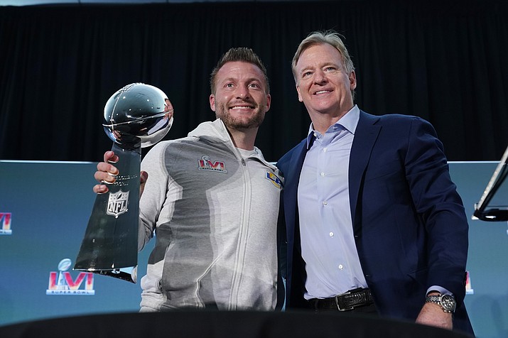 Los Angeles Rams head coach Sean McVay, left, holds the Vince Lombardi trophy during a press conference while posing for photos with league commissioner Roger Goodell following the team's Super Bowl win over the Cincinnati Bengals Monday, Feb. 14, 2022, in Los Angeles. (Marcio Jose Sanchez/AP)