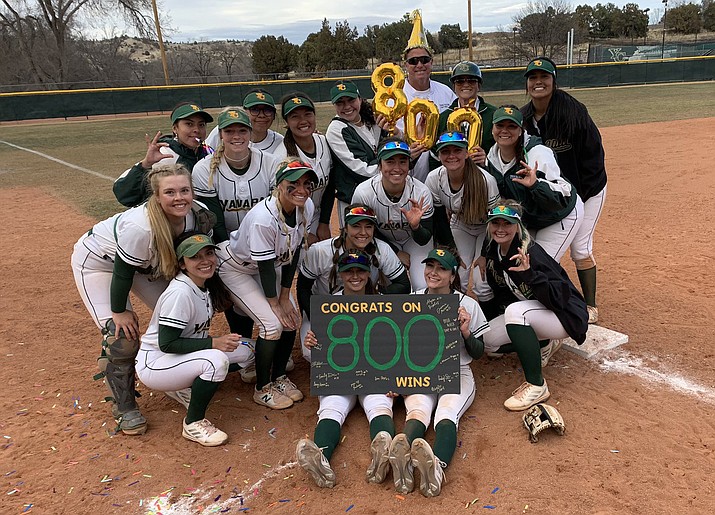 The Yavapai softball team celebrates with head coach Doug Eastman after he earned his 800th career win with the team’s sweep of Paradise Valley on Tuesday, Feb. 15, 2022, at Bill Vallely Field in Prescott. (Yavapai Athletics/Courtesy)