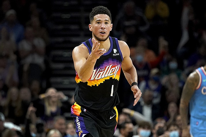 Phoenix Suns guard Devin Booker (1) motions after making a three pointer against the Los Angeles Clippers during the second half of an NBA basketball game Tuesday, Feb. 15, 2022, in Phoenix. The Suns won 103-96. (Matt York/AP)