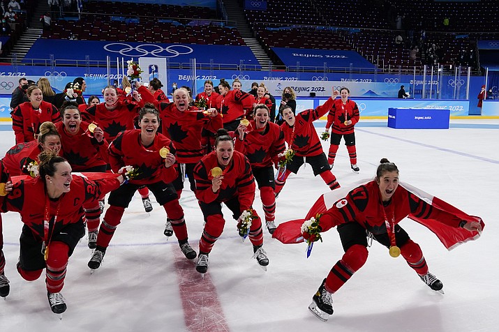 Canada players celebrate with their gold medals after the women's gold medal hockey game at the 2022 Winter Olympics, Thursday, Feb. 17, 2022, in Beijing. (Matt Slocum/AP)
