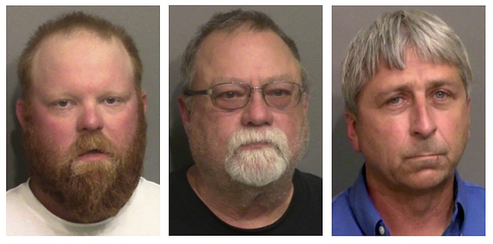 This combo of booking photos provided by the Glynn County, Ga., Detention Center, shows from left, Travis McMichael, his father Gregory McMichael, and William "Roddie" Bryan Jr. Legal experts say federal hate crimes charges in the 2020 chase and killing of Ahmaud Arbery could prove more difficult to prosecute than the fall murder trial that ended in convictions of three white men. Jury selection is scheduled to begin Monday, Feb. 7, 2022 in U.S. District Court in Brunswick, Georgia.(Glynn County Detention Center via AP, File)