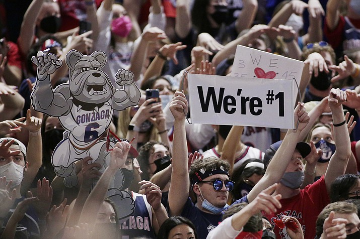 Spectators in the Gonzaga student section hold signs while watching the second half of the team's game against Santa Clara, Saturday, Feb. 19, 2022, in Spokane, Wash. Gonzaga won 81-69. (Young Kwak/AP)