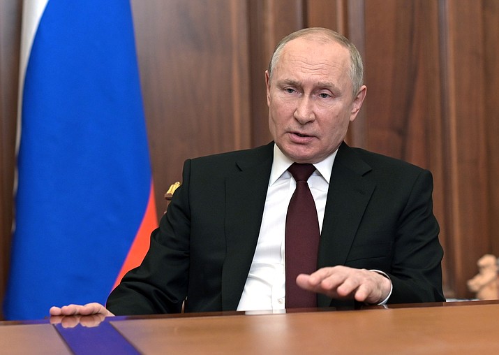 Russian President Vladimir Putin addresses the nation in the Kremlin in Moscow, Russia, Monday, Feb. 21, 2022. Russia's Putin has recognized the independence of separatist regions in eastern Ukraine, raising tensions with West. (Alexei Nikolsky, Sputnik, Kremlin Pool Photo via AP)