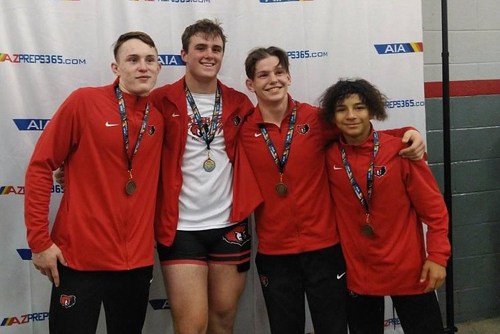 Four Bradshaw Mountain wrestlers take a photo after placing at the 2022 AIA Division III state tournament at Veterans Memorial Coliseum in Phoenix on Saturday, Feb. 19, 2022. (Bud Nollet/Courtesy)