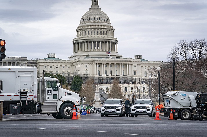 Heavy vehicles are set near the entrance to Capitol Hill at Pennsylvania on Tuesday, Feb. 22, 2022 (J. Scott Applewhite/AP)