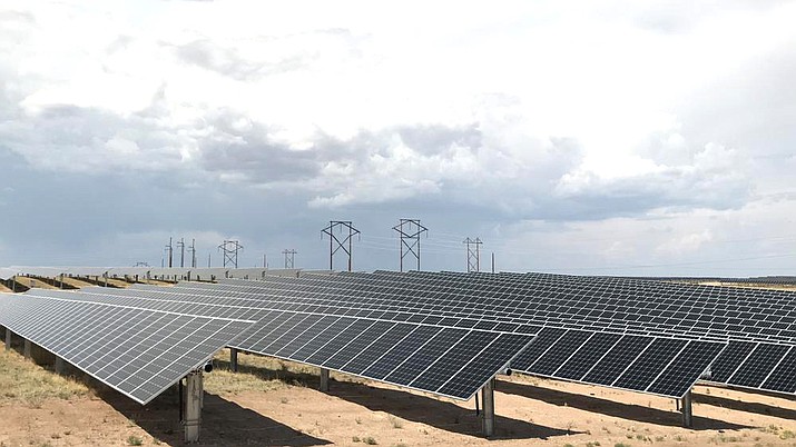 This June 15, 2021 photo shows a Public Service Co. of New Mexico solar farm west of Rio Rancho, N.M. (AP Photo/Susan Montoya Bryan, File)
