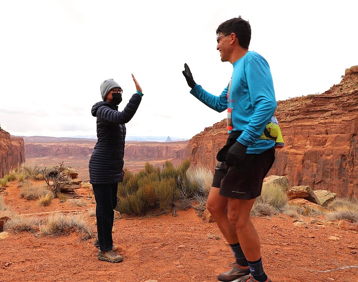 Navajo Nation First Lady Phefelia Nez greets a runner at the Monument Valley Ultra 50-miler, 50K and trail half-marathon March 5. The race is part of the 2022 Navajo Parks Race Series. (Photo/OPVP)