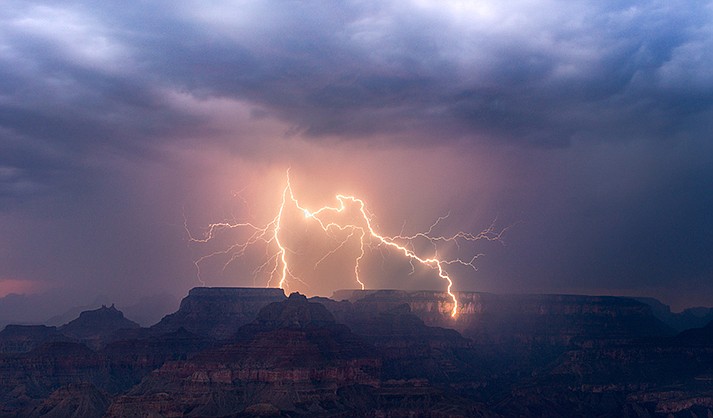 After sunset, a storm at the Grand Canyon sends out a lightning bolt that strikes down one of the canyon walls on Aug. 17, 2021.
Photos by Mike Olbinski