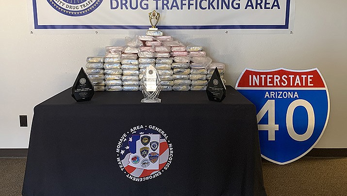 Detectives with the Mohave Area General Narcotics Enforcement Team arrested a Dominican Republic man after finding 143 pounds of suspected cocaine during a commercial vehicle inspection on Interstate 40. The drugs, which have a street value of $2 million, are pictured. (MCSO photo)