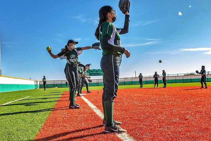 Lady Warriors on a pre-game warm up prior to the start of the second game. The Tuba City varsity softball team won their home non-conference game against Hopi (Keams Canyon, Arizona) by a score of 22-16 March 8. (Gilbert Honanie/NHO)