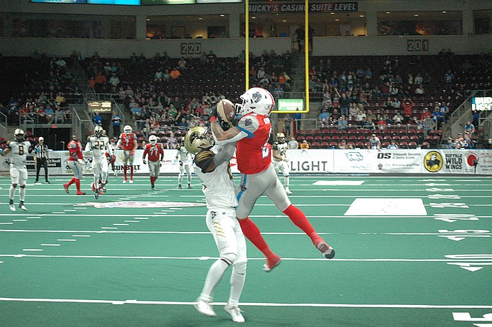 KJ Stephenson hauls in a long pass during the Wranglers 49-20 rout of the Bay Area Panthers in their home opener at the Findlay Toyota Center in Prescott Valley Saturday night. (Doug Cook/Prescott News Network