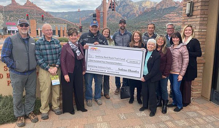 Village residents and Board Members of the Sedona Red Rock Trail Fund, Kevin Adams and Joan Bouck met with Michelle Conway of the Sedona Chamber of Commerce and Sedona Mayor Sandy Moriarity who presented a check for $102,00 to Sedona Red Rock Trail Fund President, Kevin Adams, and District Ranger Amy Tinderholt on March 10, 2022. (Courtesy photo)