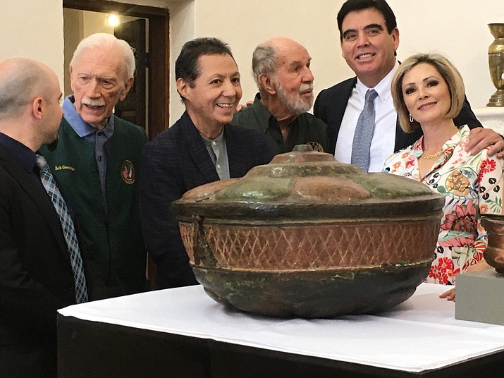 Prescott Sister City members Bob Greninger, second from left, and Ed Williams, fourth from left, stand in front of the baptismal font that was recently returned to the historic Our Lady of Immaculate Conception of Caborca, Sonora, Mexico with representatives of Arizona Historical Society, the Sonora Center, and the City of Caborca. In early April 2022, the two Prescott men were honored for their efforts in getting the font returned to its original owners. (Will Fisher/Courtesy photo)
