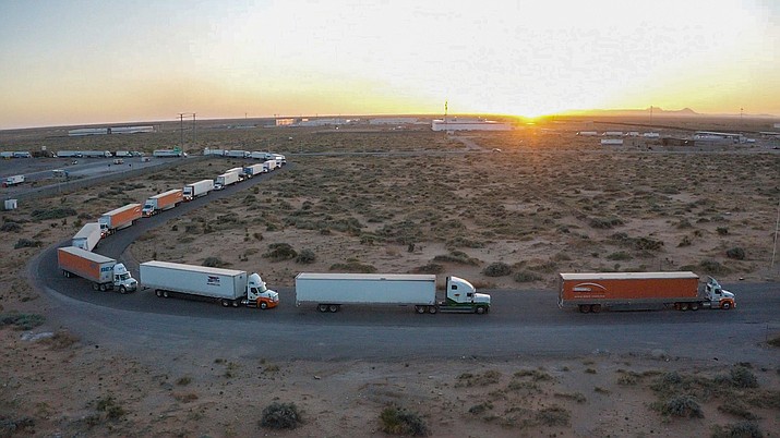Truckers block the entrance into the Santa Teresa Port of Entry in Ciudad Juarez going into New Mexico on April 12, 2022. The truckers blocked the port as a protest to the prolonged processing times implemented by Gov. Abbott which they say have increased from 2-3 hours up to 14 hours in the last few days. (Omar Ornelas/The El Paso Times via AP)