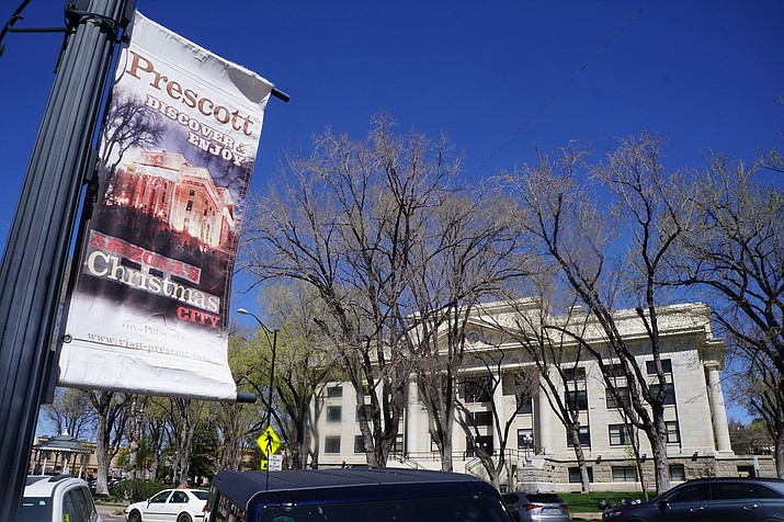 The banners that decorate the streets of downtown Prescott date back seven years or more, and they are becoming tattered with wear, say city officials. During a Prescott City Council study session on Tuesday, April 12, 2022, Prescott’s tourism staff outlined a plan for buying about 160 new banners that would all be in the same design and would feature various scenes and events around Prescott. (Cindy Barks/Courier)