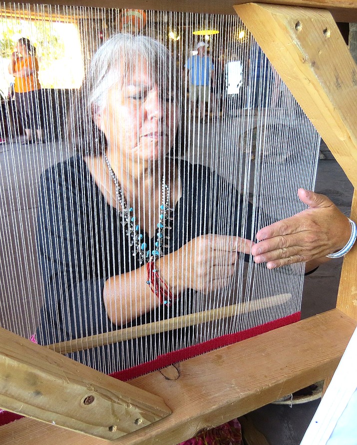 Rose Bighorse is a fourth generation weaver and specializes in weaving pillows. (Photo/National Park Service)