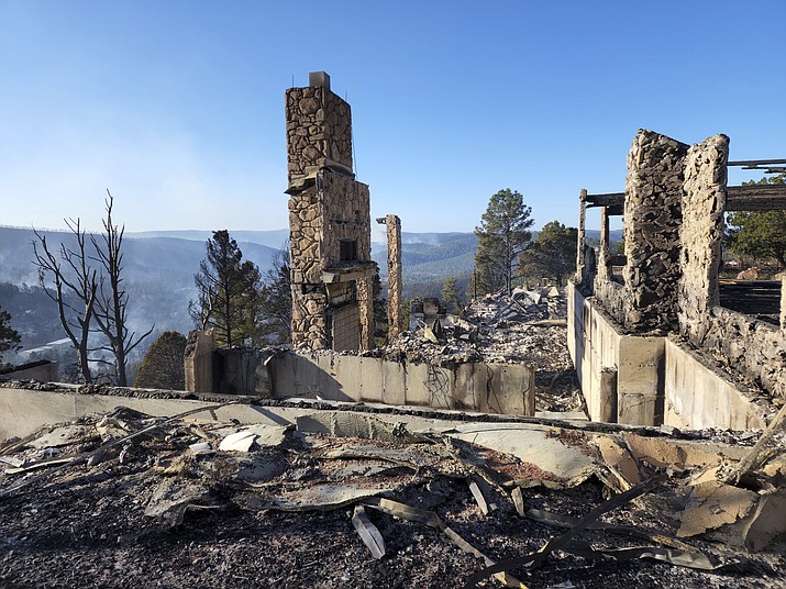 The remains of a home left after a wildfire spread through the Village of Ruidoso, N.M. April 13. Officials said a wildfire has burned more than 200 structures, including homes, in the New Mexico town of Ruidoso. (Alexander Meditz via AP)