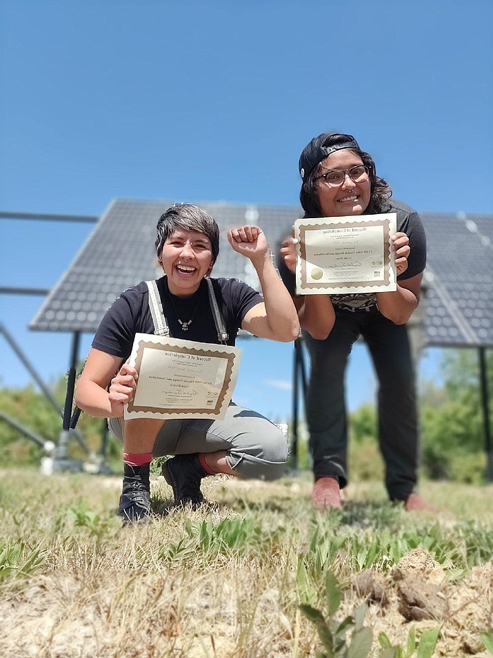 Parvannah Lee and Ryannen Ahasteen, both Navajo,  received certificates from Red Cloud Renewables. They were trained by T4 graduate students. (Photo/Ryne Mathias)