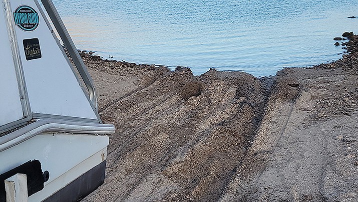 The South Cove dirt boat launch is pictured on Friday, April 15 after a pontoon boat was pulled out. It took two trucks to get the boat/trailer out. (Photo by Don Martin/For the Miner)
