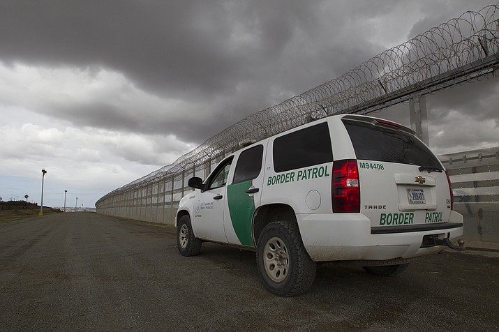 A Border Patrol vehicle by the border wall between San Diego and Tijuana in this 2016 file photo. Lawmakers sparred at a recent House hearing over whether a surge at the border contributes to human trafficking. (Donna Burton/U.S. Customs and Border Protection via Cronkite News)