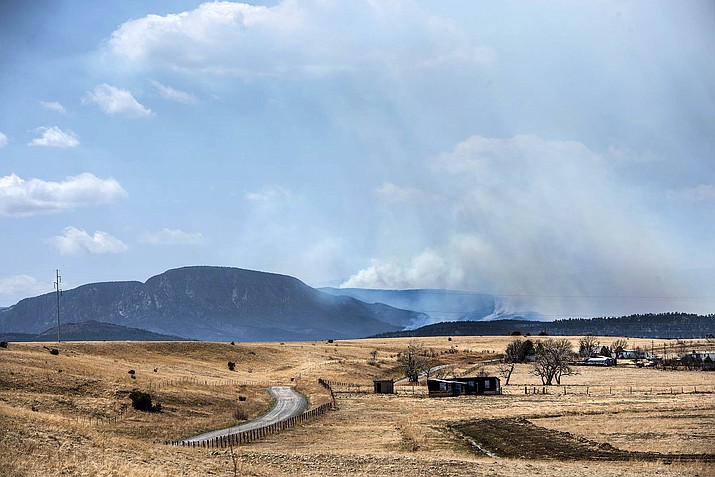 The Calf Canyon Fire burns north of Las Vegas near the San Miguel and Mora County line April 25, 2022. (Eddie Moore/The Albuquerque Journal via AP)