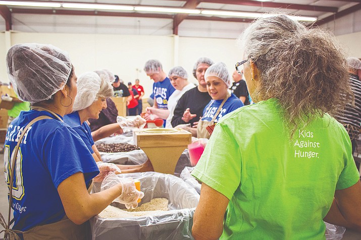 Kids Against Hunger packing event. (The Verde Independent/file/Vyto Starinskas)