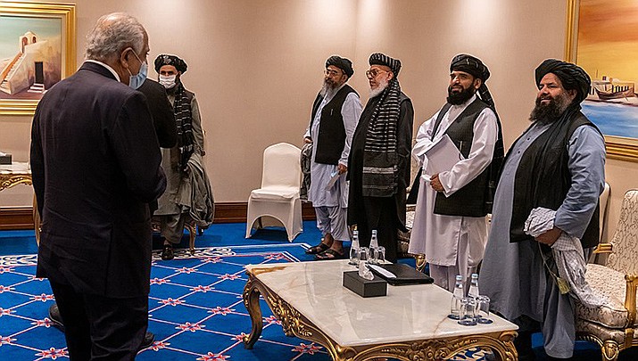 Former U.S. Secretary of State Mike Pompeo talks to Taliban leadership in November, 2020. Since taking over Afghanistan, the Taliban have been reverting to former hardline measures, and now have required women to wear head-to-toe clothing in public. (U.S. State Department photo/Public domain)