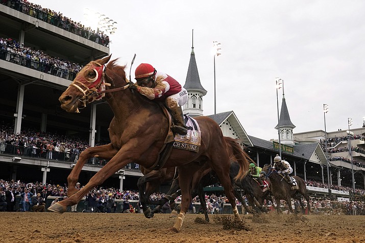Rich Strike (21), with Sonny Leon aboard, wins the 148th running of the Kentucky Derby at Churchill Downs Saturday, May 7, 2022, in Louisville, Ky. (Jeff Roberson/AP)