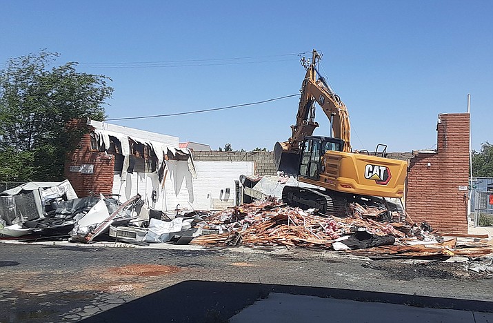 A demolition crew worked to flatten the old Circle K building at Robert Road and Highway 69 on Monday, May 9, 2022. (Tim Wiederaenders/Courier)