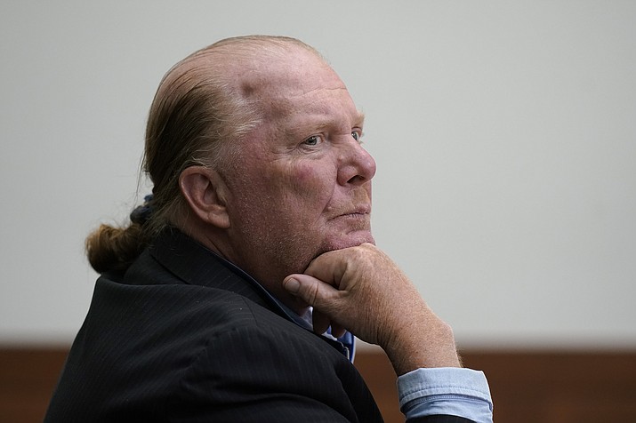 Celebrity chef Mario Batali listens at Boston Municipal Court on the first day of his pandemic-delayed trial, Monday, May 9, 2022, in Boston. Batali pleaded not guilty to a charge of indecent assault and battery in 2019, stemming from accusations that he forcibly kissed and groped a woman after taking a selfie with her at a Boston restaurant in 2017. (Steven Senne/AP, Pool)