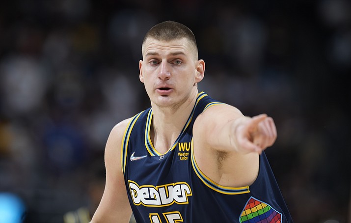 Denver Nuggets center Nikola Jokic gestures after hitting a 3-point basket against the Golden State Warriors in the first half of Game 4 of a first-round Western Conference playoff series Sunday, April 24, 2022, in Denver. (David Zalubowski/AP)