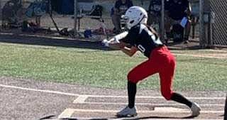 St. Michael sophomore Shayla Meyers attempts a bunt against St. David in a recent playoff game. The Lady Cardinals won the 1A state playoff opener, 9-2. (Photo/St. Michael Indian School)