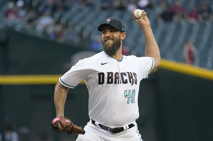 Arizona Diamondbacks pitcher Madison Bumgarner throws against the Miami Marlins in the first inning during a game, Tuesday, May 10, 2022, in Phoenix. (Rick Scuteri/AP)