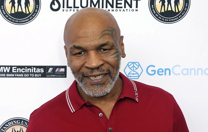 Mike Tyson attends a celebrity golf tournament in Dana Point, Calif., Aug. 2, 2019. Authorities will not file criminal charges against former heavyweight champ Mike Tyson after he was recorded on video punching a fellow first-class passenger aboard a plane at San Francisco International Airport last month, prosecutors announced Tuesday, May 10, 2022. (Willy Sanjuan/Invision/AP, File)