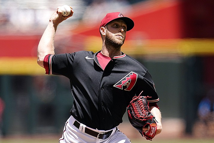 Arizona Diamondbacks starting pitcher Merrill Kelly throws against the Miami Marlins during the first inning of a baseball game Wednesday, May 11, 2022, in Phoenix. (Ross D. Franklin/AP)