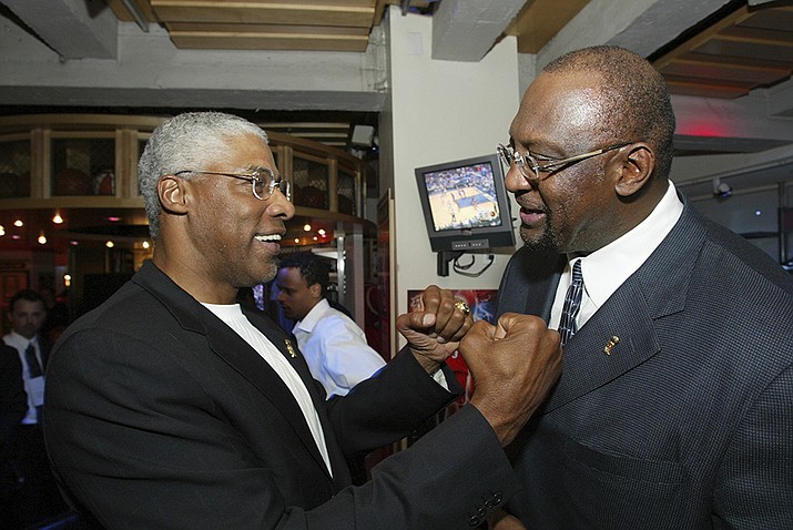 NBA legend Julius 'Dr. J' Erving, left, greets former Milwaukee Bucks' Bob Lanier during LeBron James presentation for the NBA Rookie of the Year award at the NBA Store on New York's 5th Avenue, Tuesday, April 20, 2004. Lanier, the left-handed big man who muscled up beside the likes of Kareem Abdul-Jabbar as one of the NBA’s top players of the 1970s, died Tuesday, May 10, 2022. He was 73.(Stuart Ramson, AP File)