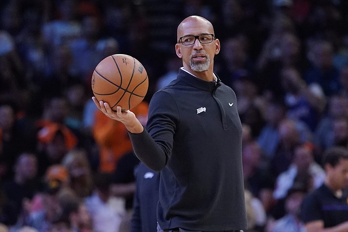 Phoenix Suns head coach Monty Williams hands off the ball during a break in the action during the first half of Game 2 in the second round of the NBA Western Conference playoff series against the Dallas Mavericks, Wednesday, May 4, 2022, in Phoenix. (Matt York/AP)