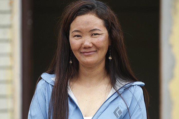 Nepalese female climber Lhakpa Sherpa talks with Associated Press in Kathmandu, Nepal, May 23, 2018. The Nepali Sherpa woman living in Connecticut scaled Mount Everest Thursday breaking her own record of the most climbs of the world's highest peak by a female climber, expedition organizers said. (Niranjan Shrestha, AP File)