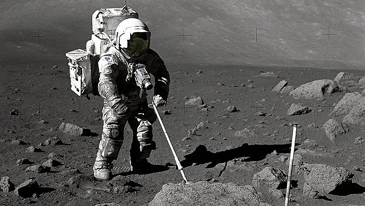 For the first time, scientists have grown plants in soil from the moon collected by NASA’s Apollo astronauts. Geologist-astronaut Harrison Schmitt, Apollo 17 lunar module pilot, uses an adjustable sampling scoop to retrieve lunar samples. (NASA photo, public domain)