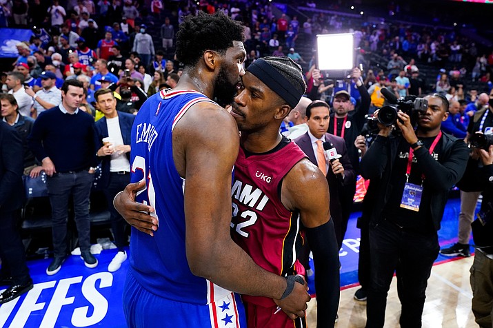 Miami Heat's Jimmy Butler, right, and Philadelphia 76ers' Joel Embiid embrace after Game 6 of a second-round playoff series, Thursday, May 12, 2022, in Philadelphia. (Matt Slocum/AP)