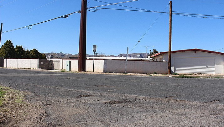 City staff proposed a property tax or a sales tax to help establish and maintain a pavement preservation program. Both options would have to be approved by voters and would help with existing paved city streets. Potholes on Airway Avenue in Kingman are pictured. (Miner file photo)