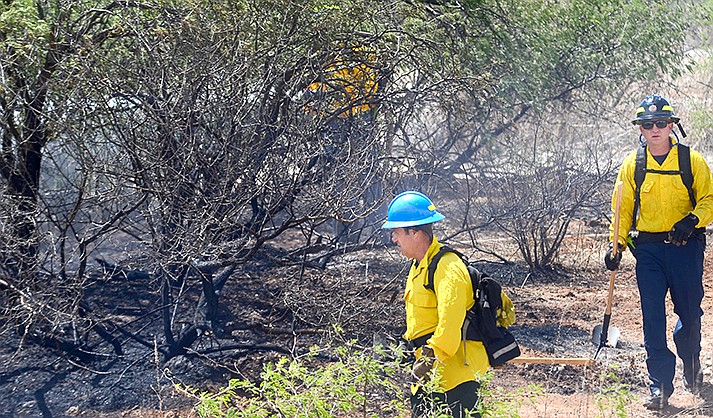 Firefights jump on a brush fire in Cornville before it could be spread by high winds. (VVN/Vyto Starinskas)