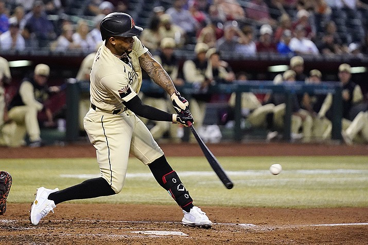 Arizona Diamondbacks' Ketel Marte connects for a run-scoring double against the Chicago Cubs during the third inning of a baseball game Friday, May 13, 2022, in Phoenix. (Ross D. Franklin/AP)