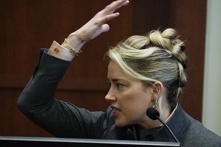 Actor Amber Heard testifies in the courtroom at the Fairfax County Circuit Courthouse in Fairfax, Va., Monday, May 16, 2022. Actor Johnny Depp sued his ex-wife Amber Heard for libel in Fairfax County Circuit Court after she wrote an op-ed piece in The Washington Post in 2018 referring to herself as a "public figure representing domestic abuse." (Steve Helber/AP, Pool)