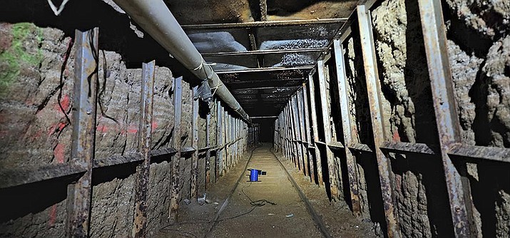 This undated photo provided by Homeland Security Investigations shows the inside of a cross border tunnel between Mexico's Tijuana into the San Diego area. Authorities announced on Monday, May 16, 2022, the discovery of the underground smuggling tunnel on Mexico's border, running the length of a football field on U.S. soil to a warehouse in an industrial area. The cross-border tunnel from Tijuana to the San Diego area was built in one of the most fortified stretches of the border, illustrating the limitations of former President Donald Trump's border wall. (Homeland Security Investigations via AP)